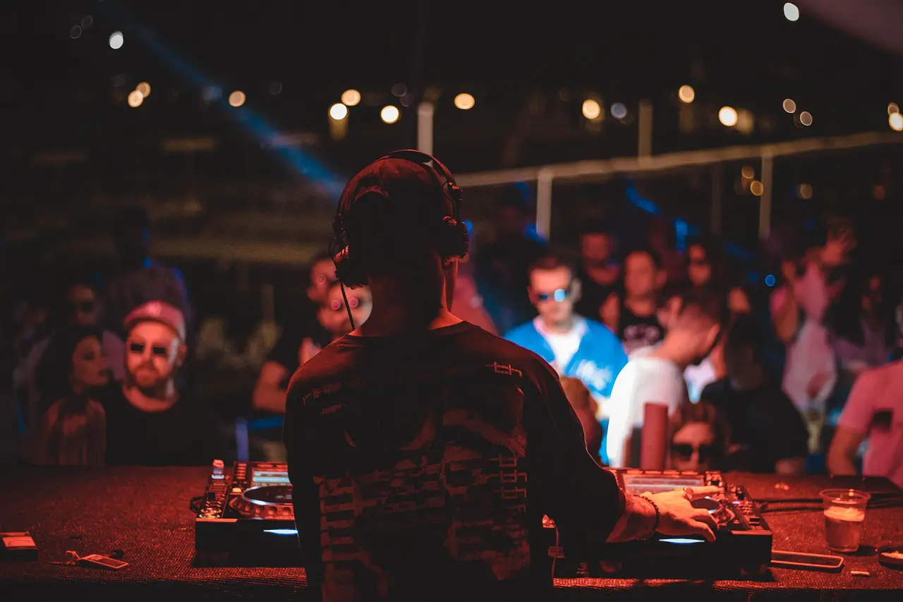 An engaging scene of a DJ mixing in real-time.