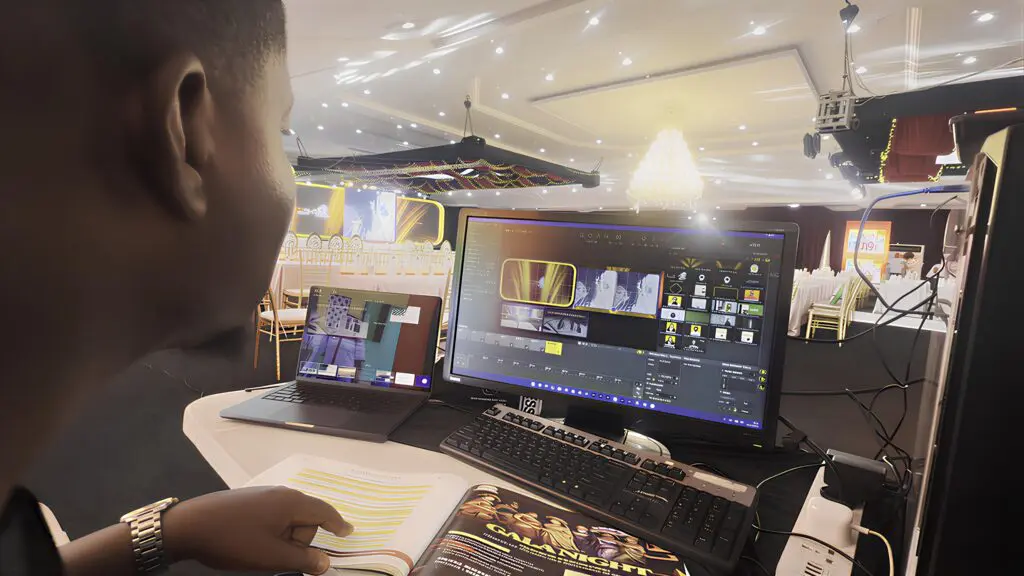 Director Mj using HeavyM software to engineer cinematic visual elements for a corporate Gala Night.