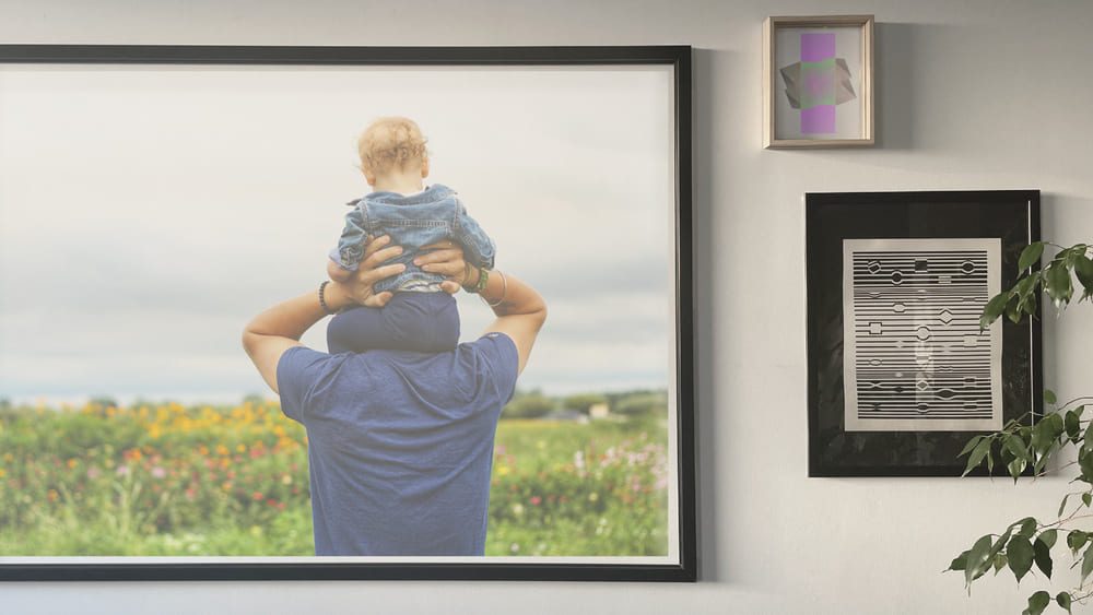 digital photo frame man holding a baby on his shoulders